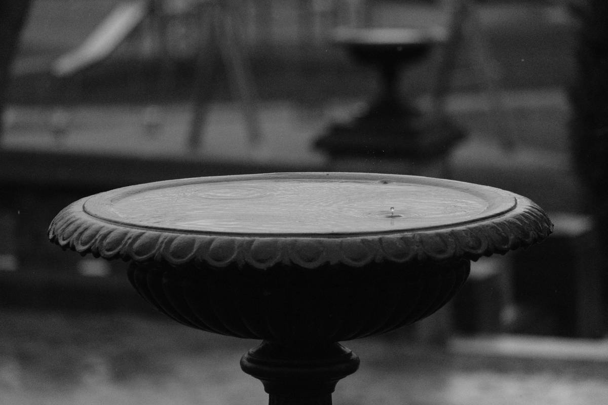 Comparison of different metal birdbath base types showing weight and durability differences
